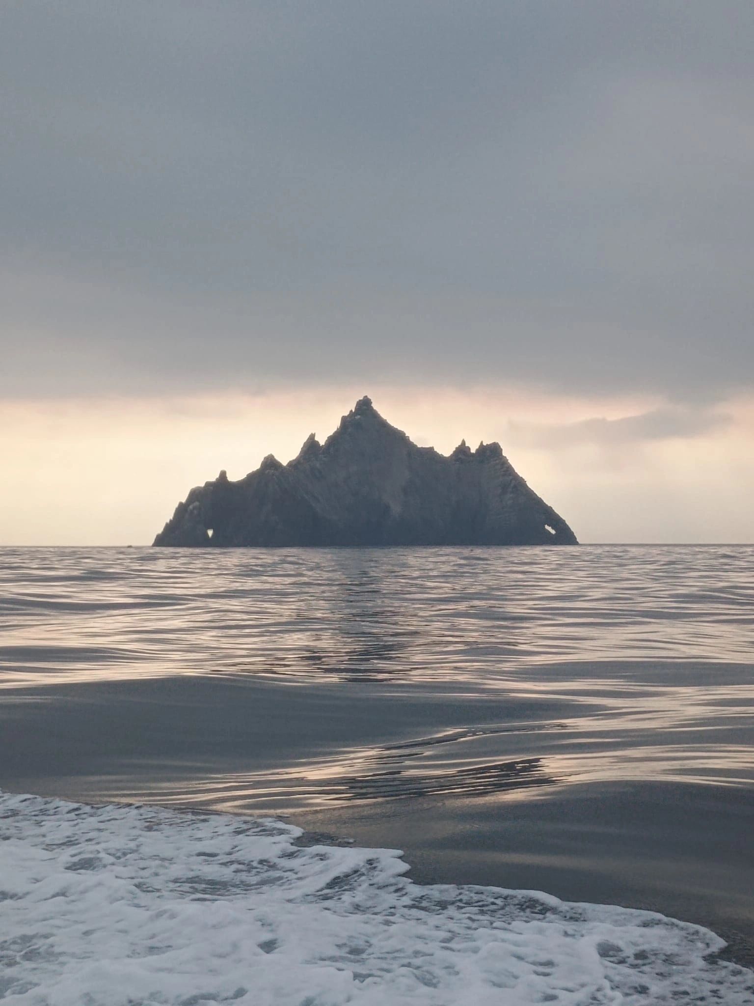 Skellig Michael rising from the Atlantic, viewed from a charter boat